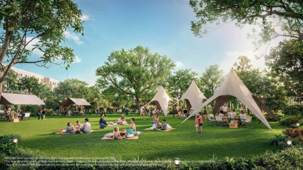 Khu picnic ngoài trời với lều dã ngoại, thảm cỏ xanh và không gian sinh hoạt gia đình trong khu đô thị của Sun Group tại Bắc Ninh.